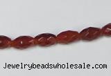 CAA124 15.5 inches 6*10mm faceted rice red agate gemstone beads