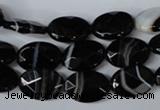 CAG3081 15.5 inches 10*14mm faceted oval black line agate beads