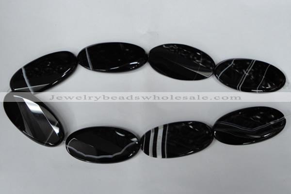 CAG3086 15.5 inches 25*50mm faceted oval black line agate beads