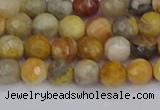 CAG9868 15.5 inches 4mm faceted round yellow crazy lace agate beads