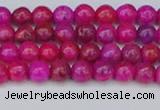 CAG9924 15.5 inches 4mm round fuchsia crazy lace agate beads