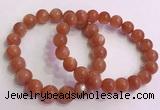 CGB4540 7.5 inches 10mm - 11mm round golden sunstone beaded bracelets