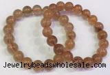 CGB4614 10mm - 11mm round golden rutilated quartz beaded bracelets