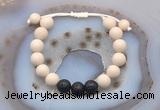 CGB6670 10mm round white fossil jasper & black lava adjustable bracelets