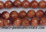 CGS471 15.5 inches 6mm faceted round goldstone beads wholesale