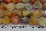 CNG6222 15.5 inches 6mm faceted nuggets yellow crazy lace agate beads