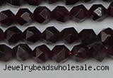 CNG7275 15.5 inches 6mm faceted nuggets red garnet beads