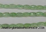 CRU165 15.5 inches 5*8mm faceted rice green rutilated quartz beads