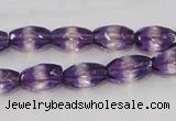 CSA25 15.5 inches 7*12mm faceted rice synthetic amethyst beads