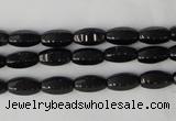 CTO116 15.5 inches 5*10mm faceted rice black tourmaline beads