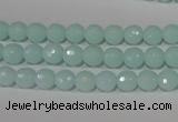 CTU2572 15.5 inches 6mm faceted round synthetic turquoise beads